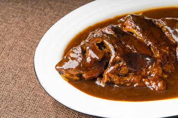 Braised crucian carp on a simple background