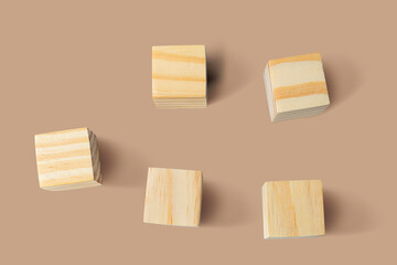 Blank wood cube block on cream color isolated background with copy space minimalist style