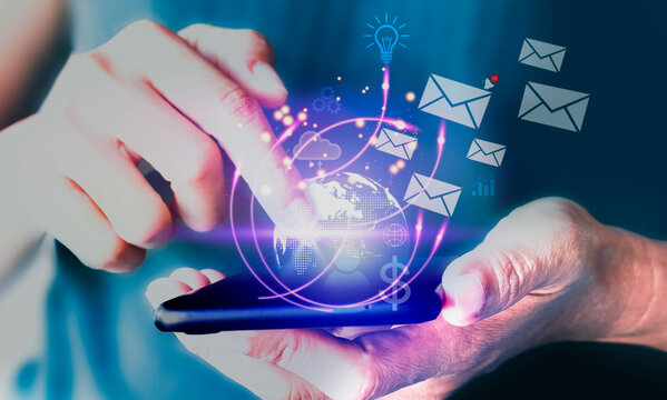 Digital technology is transforming manufacturing, making it leaner and smarter. Businessman using Smart Phone with the email, message icons.