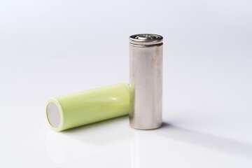 Camera battery and lithium battery on simple background