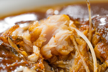 Braised crucian carp on a simple background