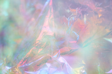 Iridescent texture. Holographic background. A hologram of gradient neon color. Foil effect. Rainbow...