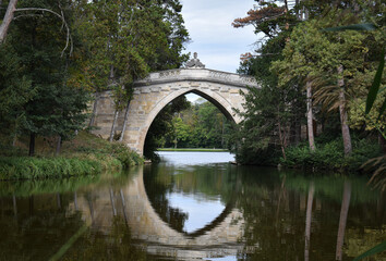 Fototapeta na wymiar A beautiful old bridge in the park