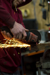 repair and tuning of an automobile engine welding work with a grinder and installation of new parts
