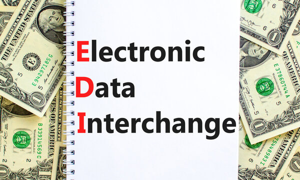 EDI electronic data interchange symbol. Concept words EDI electronic data interchange on white note on a background from dollar bills. Business and EDI electronic data interchange concept. Copy space.