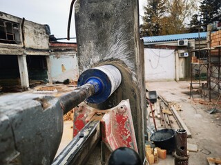Hole cutting machine. Drilling concrete with an industrial drilling machine with an industrial diamond grain. Core drills used in ring cutters for reinforced concrete columns