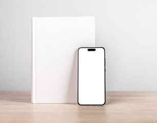 Book cover mock up and iphone 14, smart phone mockup on wood table