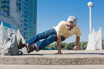  Man dancing yellow shirt blue jeans sunglasses