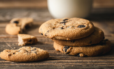 Chocolate chip cookies close up on a wooden background.
