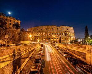 Colosseum by night , the largest ancient amphitheatre ever built - 544171729