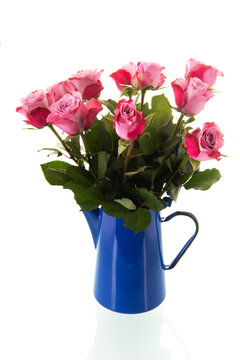 Bouquet pink roses in vintage coffee pot