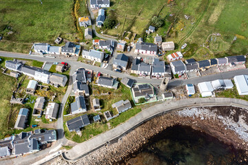 Aerial view of the settlement An Baile Thiar or West Town on Tory Island and harbour, County Donegal, Republic of Ireland © Lukassek
