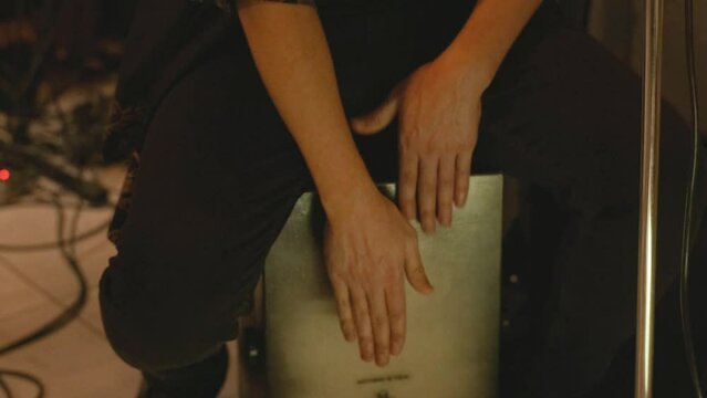 Man drumming rhythm kahon cajon music instrument concert, play band