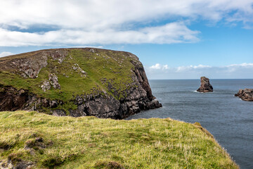 The cliffs and sea stacks at Port Challa on Tory Island, County Donegal, Ireland © Lukassek