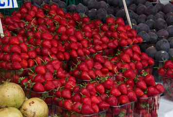lot of strawberries on the counter market. A lot of strawberries, strawberries on the market counter