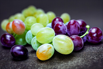 white and black grapes lie on a dark background