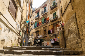 Motorcycle over stairs in neighbourhood in Naples, Italy
