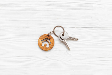 Real estate concept with house shaped keychain and keys