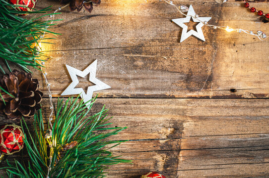 Wooden Christmas background with decor details, flat lay.