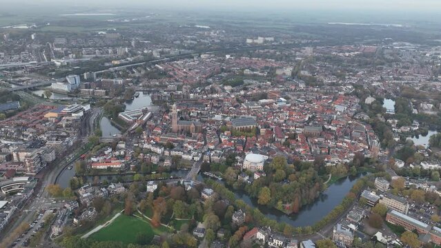 Zwolle old historic city center and city walls overhead skyline. Canal around city with rich history, Pepperbus church tower, Sassenpoort, Onze Lieve Vrouwebasiliek aerial.