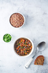 Obraz na płótnie Canvas Green Lentil carrots red pepper vegan soup in a bowl