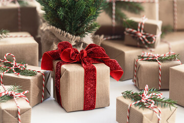 Fototapeta na wymiar Christmas Gifts wrapped in brown paper . Christmas Gift wrapping concept.