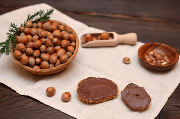 toasts with chocolate cream and hazelnuts on the table