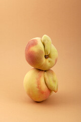 Ugly peach fruits. Deformed ripe peaches, close-up. Concept - Reduce organic food waste. Last trend...