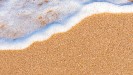 sandy beach sea water on a sunny summer day