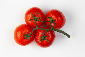 branch of tomatoes on a white background