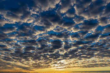 sunrise with gray stratus clouds - obrazy, fototapety, plakaty
