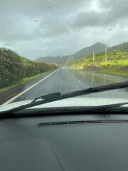 Obraz premium car on the road with raimbow