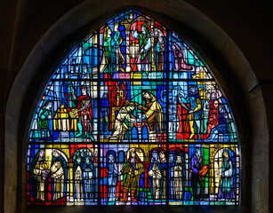 Stained-glass window In Église St. Michel (St. Michael's Church) depicting the history of St...
