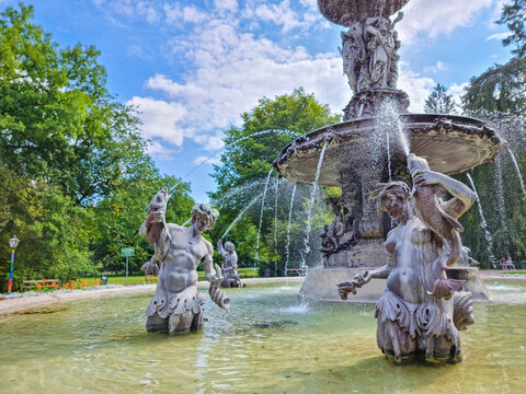 Beautiful fountain in the city park Stadtpark, a green island in the middle of the city center of Graz, Styria region, Austria. Selective focus