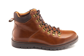 men's leather brown boots for winter or autumn hiking on a white background. Men's fashion, trendy shoes. Close-up