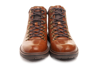 men's leather brown boots for winter or autumn hiking on a white background. Men's fashion, trendy shoes. Close-up