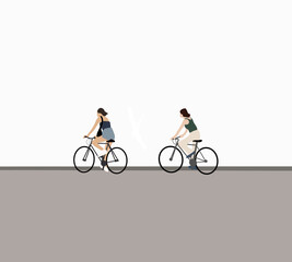 Naklejka premium Two women riding their bicycles on street city. Cycling and enjoying their holiday vacation.