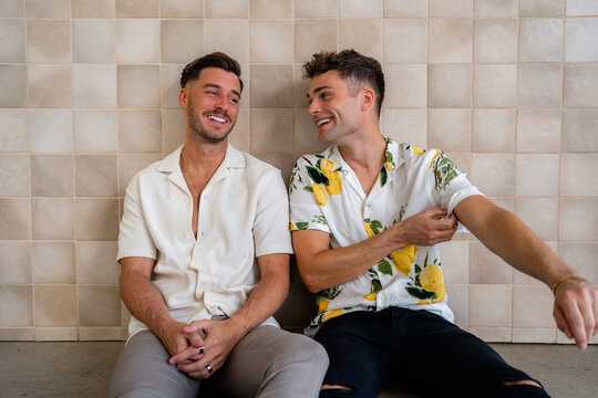 Beautiful Gay couple sitting and talking 