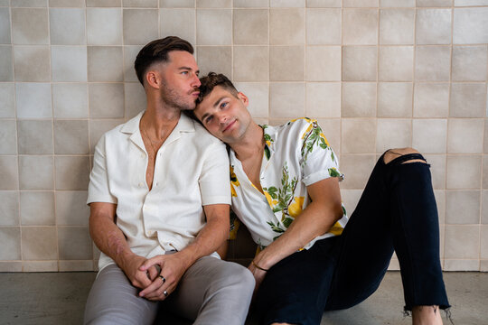 Beautiful Gay couple sitting on the floor