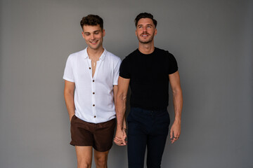 beautiful gay couple holding hands