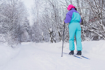 Beautiful cold forest view of ski run track on ski resort, winter day on a slope, pist, nordic...