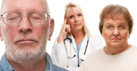 Concerned Senior Couple and Female Doctor Behind