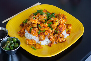 Asian plates with rice and vegetables on top. Japanese food.