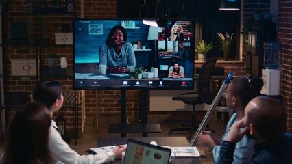 Business team remote meeting, coworkers videocall at night time. Diverse people talking in online conference, colleagues brainstorming on videoconference in office zoom in