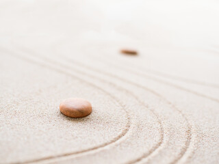 Fototapeta na wymiar Zen Garden japanese with White Pebble and Texture Line on Sand Background,Top View Rock on Sand Symbols Meditation Still Religion Janpan,Nature Balance Circle Rock for Spa and Calm Buddhism Concept.