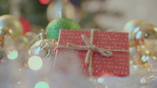 Close up of christmas present under the christmas tree, christmas decorations
