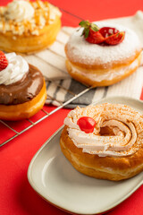 Delicious donuts with red background