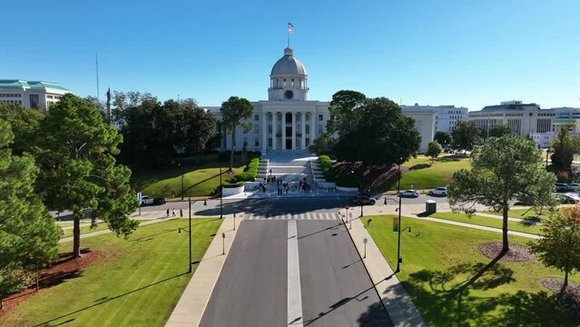 Montgomery Alabama state capital. Government buildings. Aerial pullback reveal shot. State capitol dome in AL, USA.