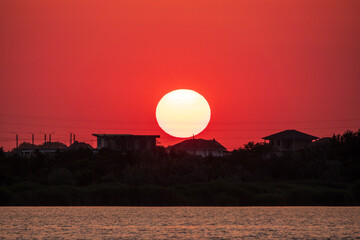 The sun goes down over a lake