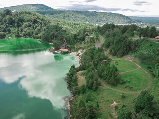 Naklejka na ściany i meble Linow lake view seen from above with several scenarios. Linow lake is located in the city of Tomohon, North Sulawesi Province, Indonesia.